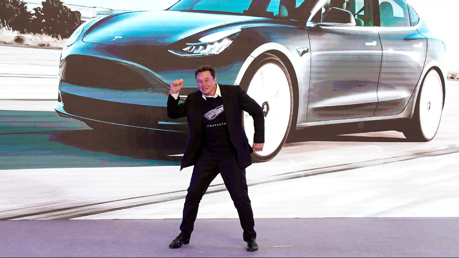 FILE PHOTO: Tesla Inc CEO Elon Musk dances onstage during a delivery event for Tesla China-made Model 3 cars in Shanghai, China January 7, 2020.