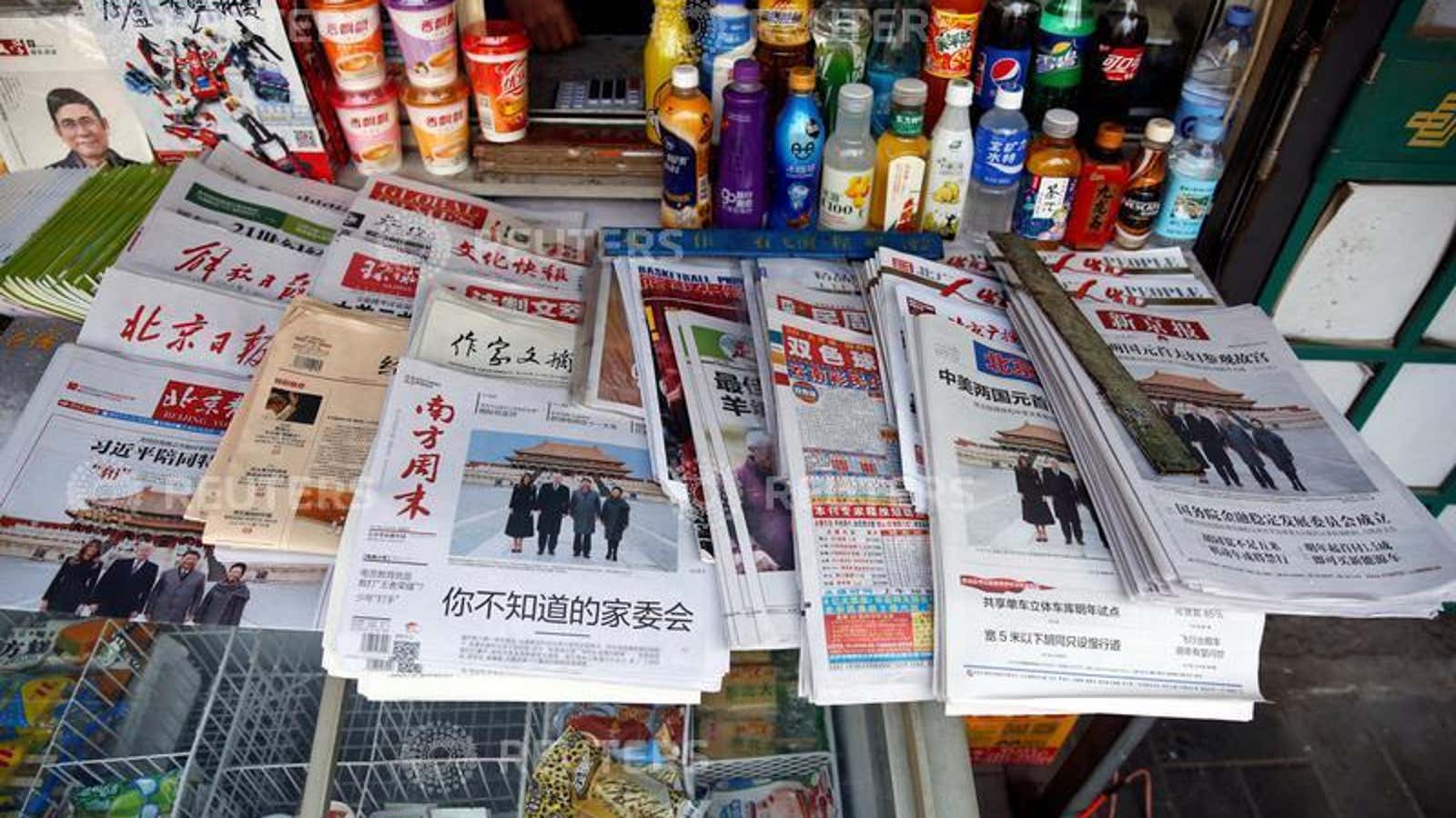 Chinese newspapers featuring a picture of  U.S. President Donald Trump and U.S. first lady Melania visiting the Forbidden City with China’s President Xi Jinping and China’s First Lady Peng Liyuan on the front page are seen at a newsstand in Beijing, China November 9, 2017. REUTERS/Aly Song – RC1861A47080