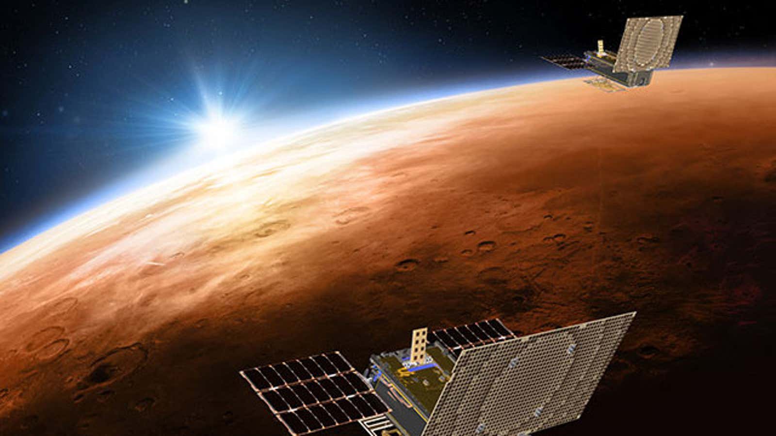 A rendering of the tiny satellites zipping by Mars.