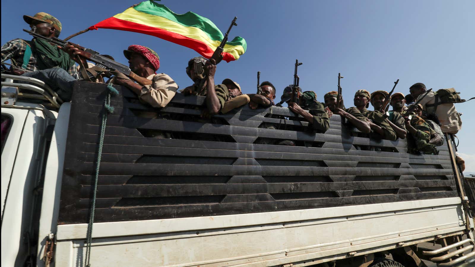 Amhara region militias ride on their truck as they head to face the Tigray People’s Liberation Front (TPLF), in Sanja, Amhara region near a border with Tigray, Ethiopia Nov. 9, 2020.