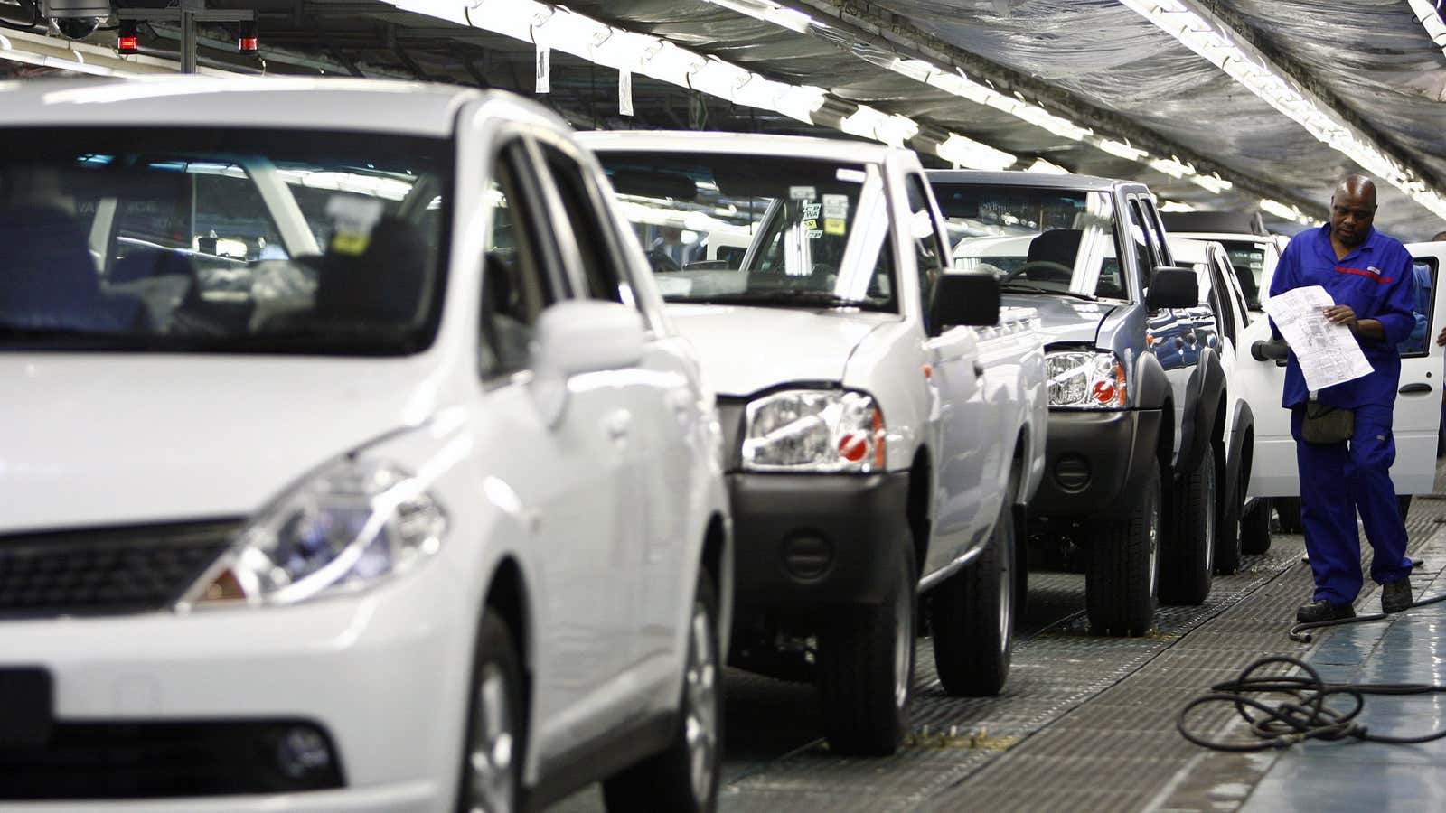 A worker inspects cars at Nissan’s manufacturing plant in Rosslyn, outside Pretoria, South Africa.