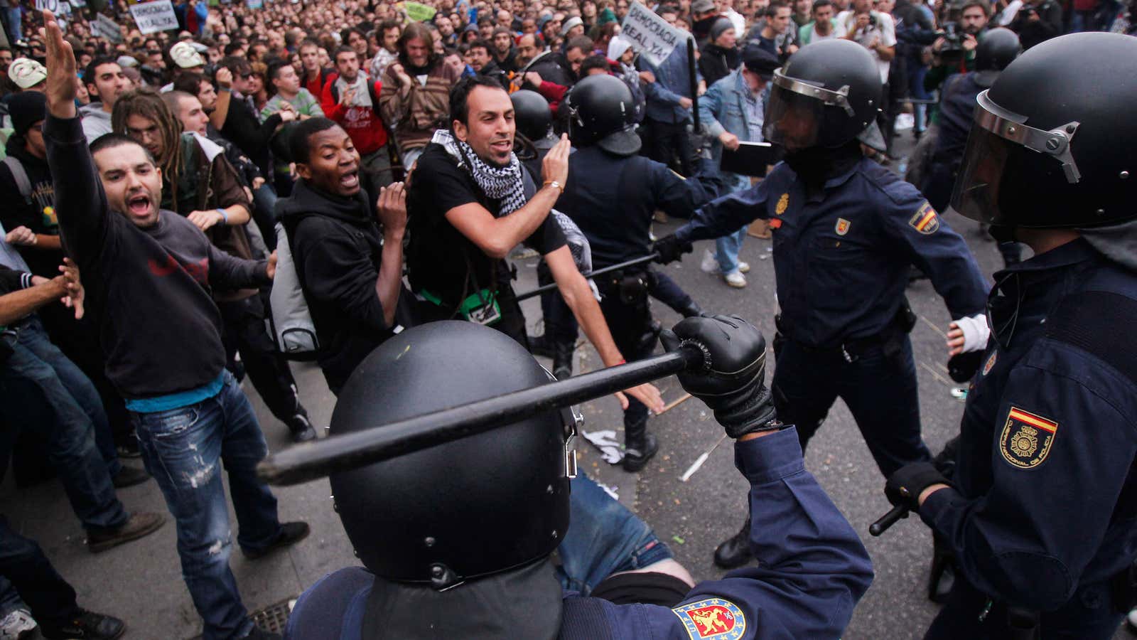 Protests clash with police during the march against austerity measures announced by the Spanish government in Madrid, Spain.