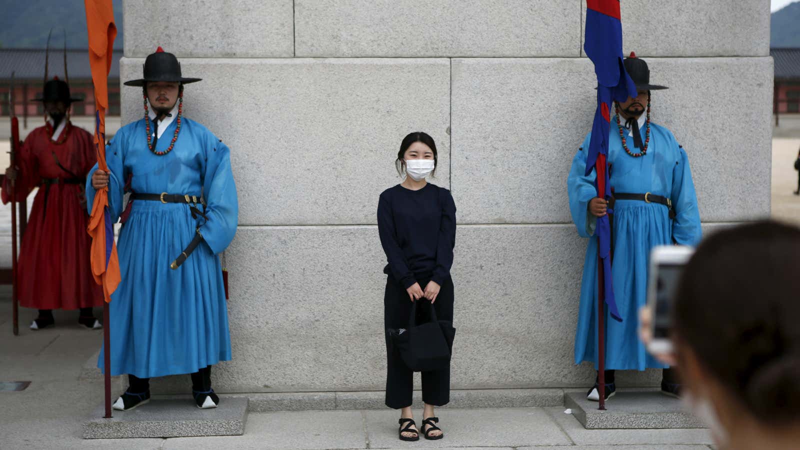 A Chinese tourist wears a mask at the Gyeongbok Palace in central Seoul.