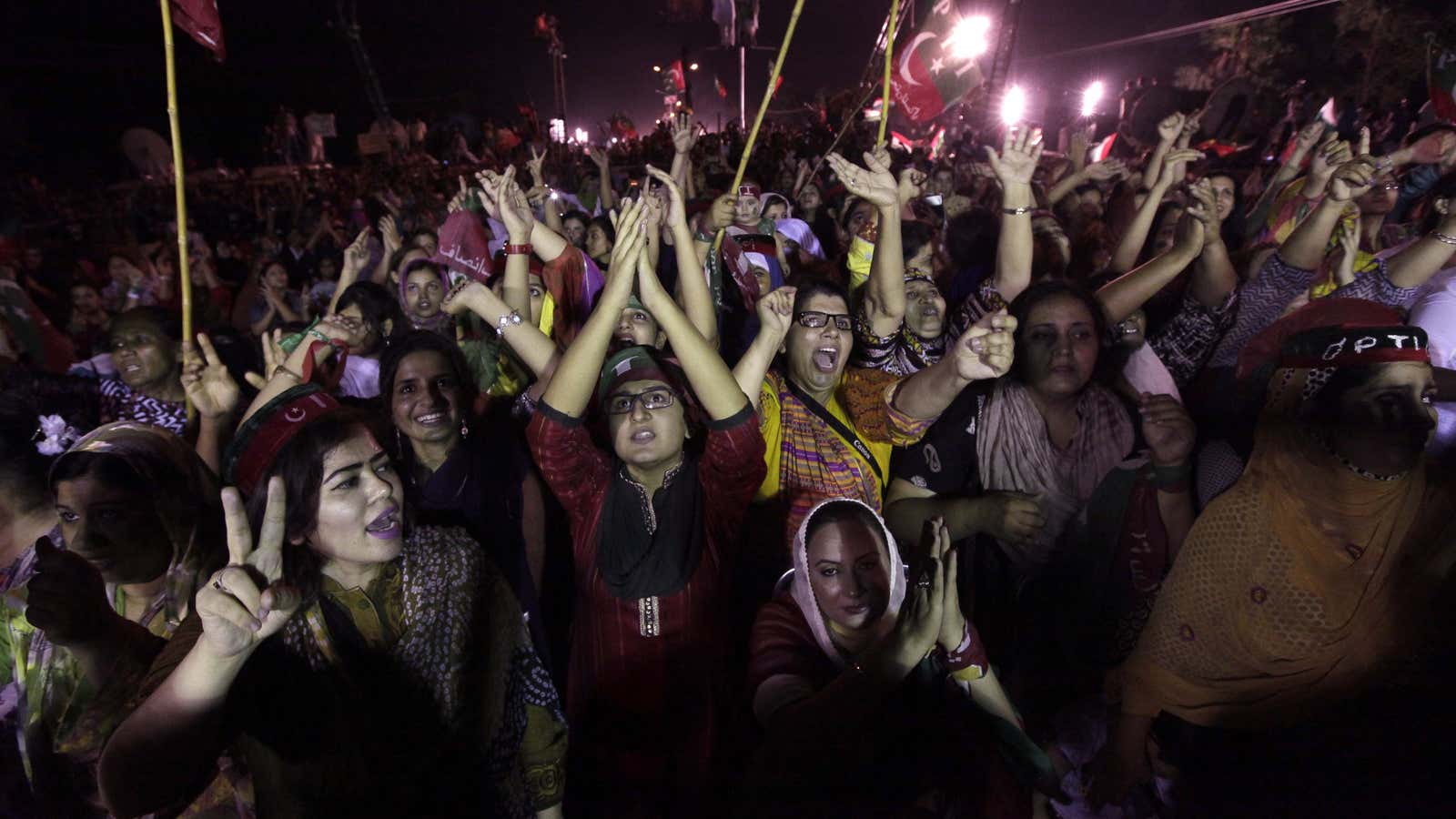 PTI supporters cheer on leader Imran Khan on Monday night in Islamabad.