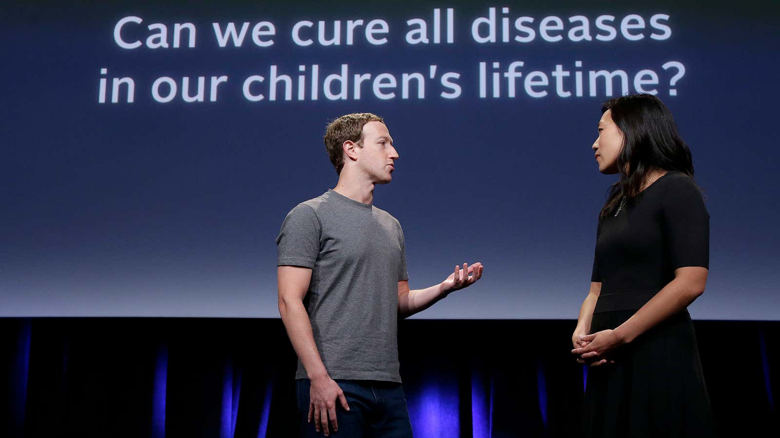 Facebook CEO Mark Zuckerberg speaks with his wife, Priscilla Chan, as they prepare for a presentation in San Francisco in 2016.