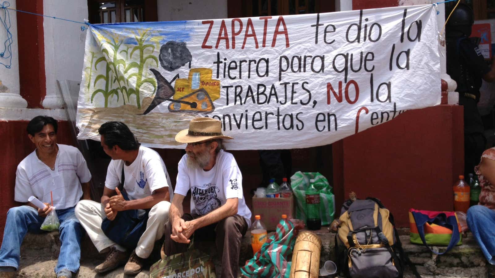 Anti- highway protestors camped out in front of Tepoztlan’s municipal palace. The sign reads: “Zapata gave you the land so that you work it, not to turn it into concrete.”