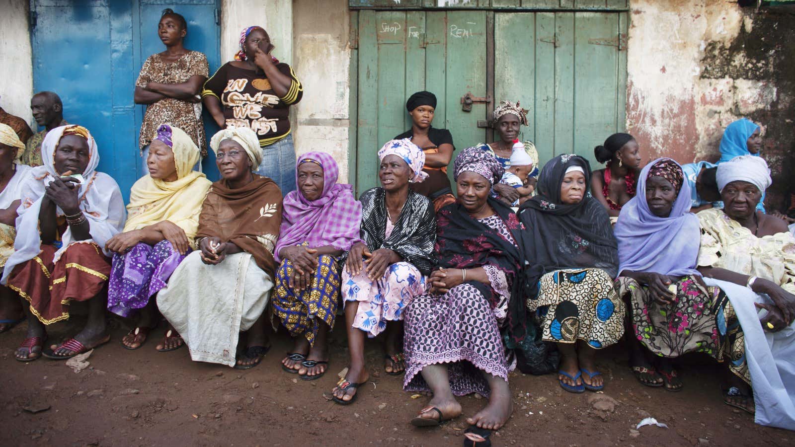 Women wait to vote in the elections that brought Ernest Bai Koroma to power