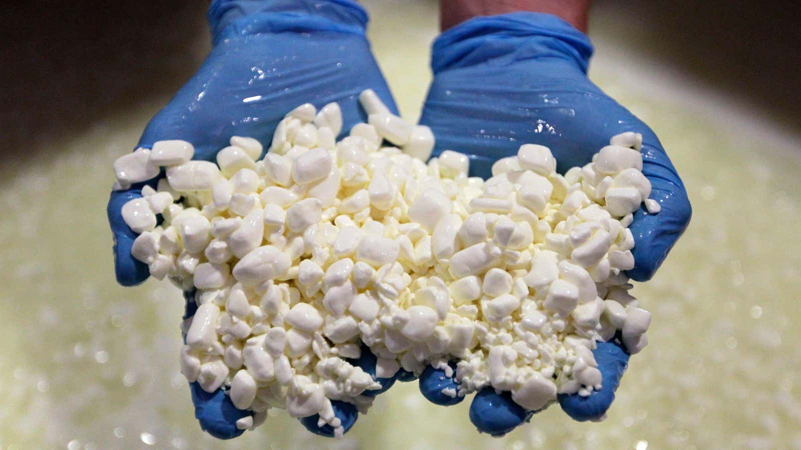 In this June 25, 2012 photo, cheese maker, Britton Comer, checks the curds as he makes a batch of cottage cheese at Traders Point Creamery in Zionsville, Ind. Traders Point is one of the few well known high-end cottage cheese makers, along with Cowgirl Creamery in northern California. (AP Photo/Michael Conroy)