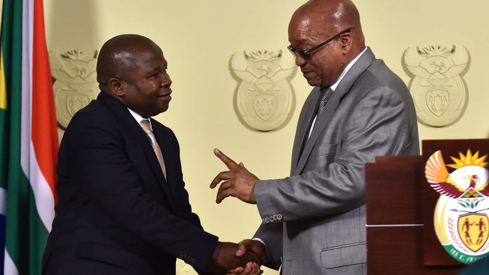 South African president Jacob Zuma, right, congratulates newly sworn-in finance minister David Van Rooyen.