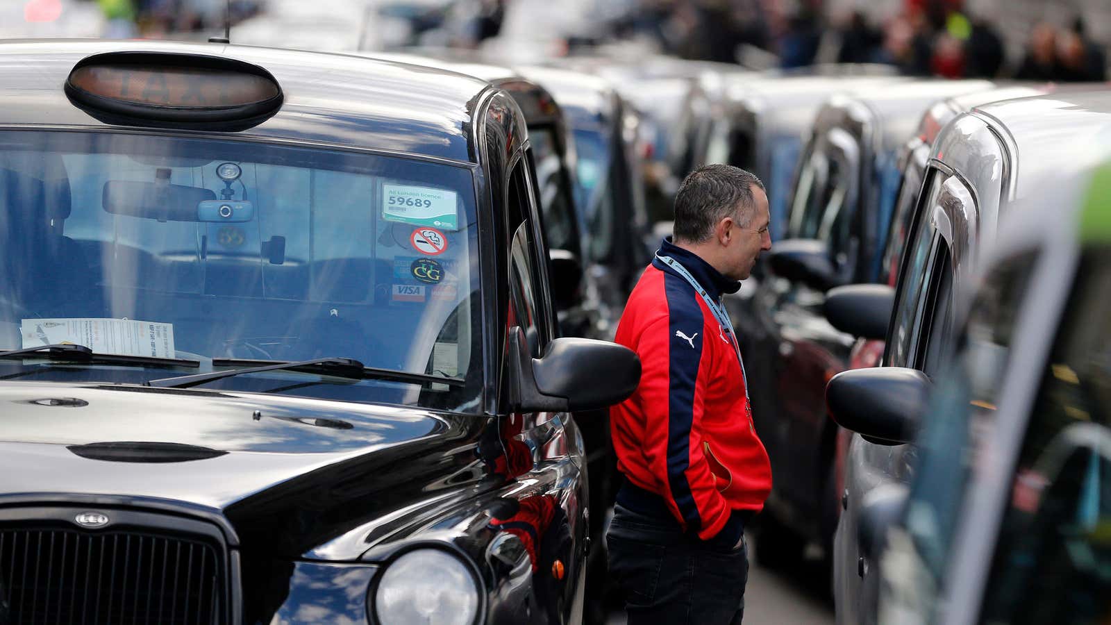 London taxi drivers protesting against ride-hailing services.