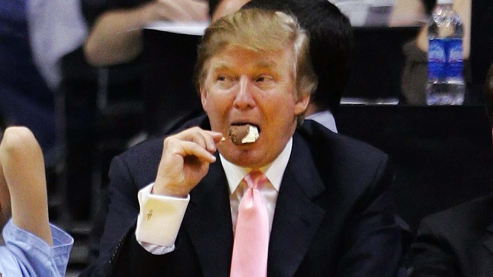 Trump enjoys an ice cream bar at a 2005 basketball match.