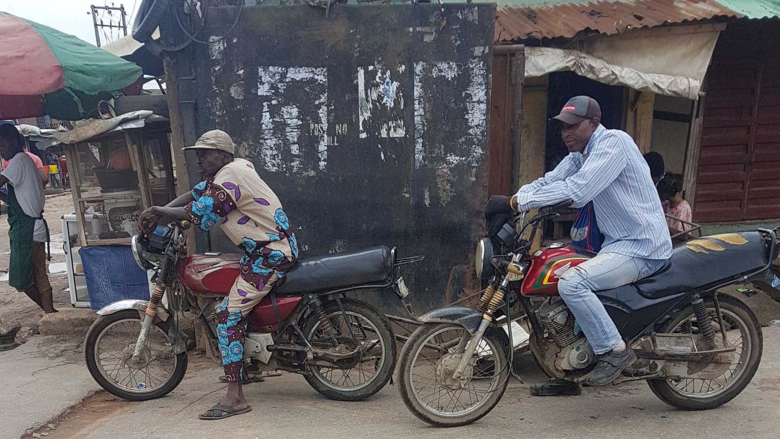 Motorcycle taxis, aka “Okadas” wait for riders on Saturday, April 4 in a Lagos suburb