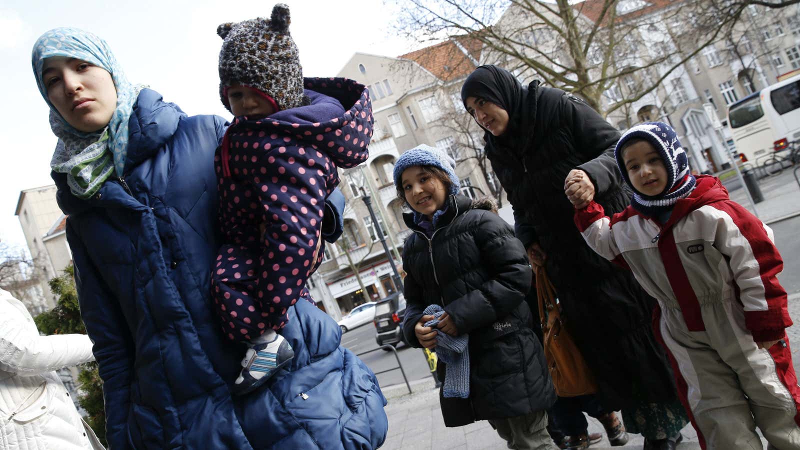 Migrants arrive at a refugee shelter in Friedenau city hall in Berlin.