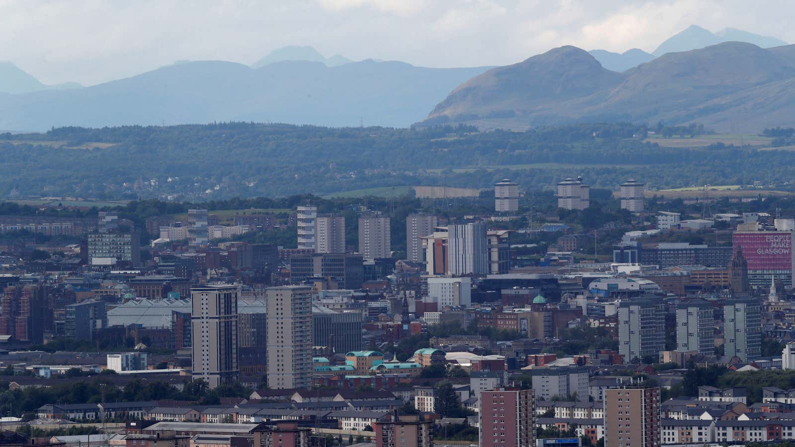 Blocks of flats in the city of Glasgow are seen from Cathkin Braes, Scotland, Britain August 7, 2018. REUTERS/Russell Cheyne – RC16257C7FD0
