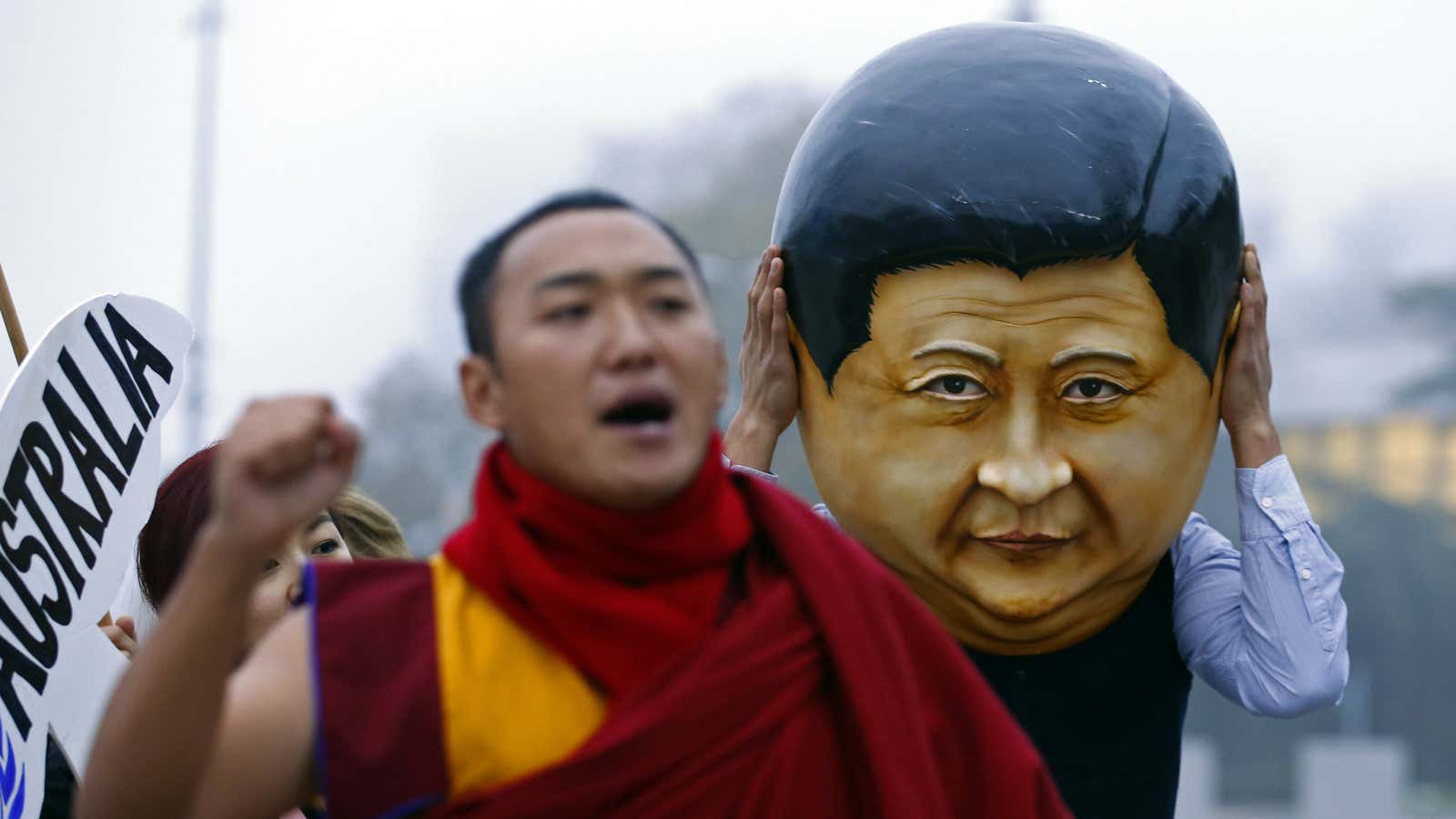 The giant head of Xi Jinping looms over protestors in Geneva.