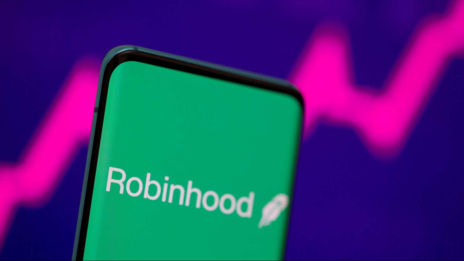 FILE PHOTO: Robinhood logo is seen on a smartphone in front of a displayed stock graph in this illustration taken, July 2, 2021. REUTERS/Dado Ruvic/Illustration/File Photo