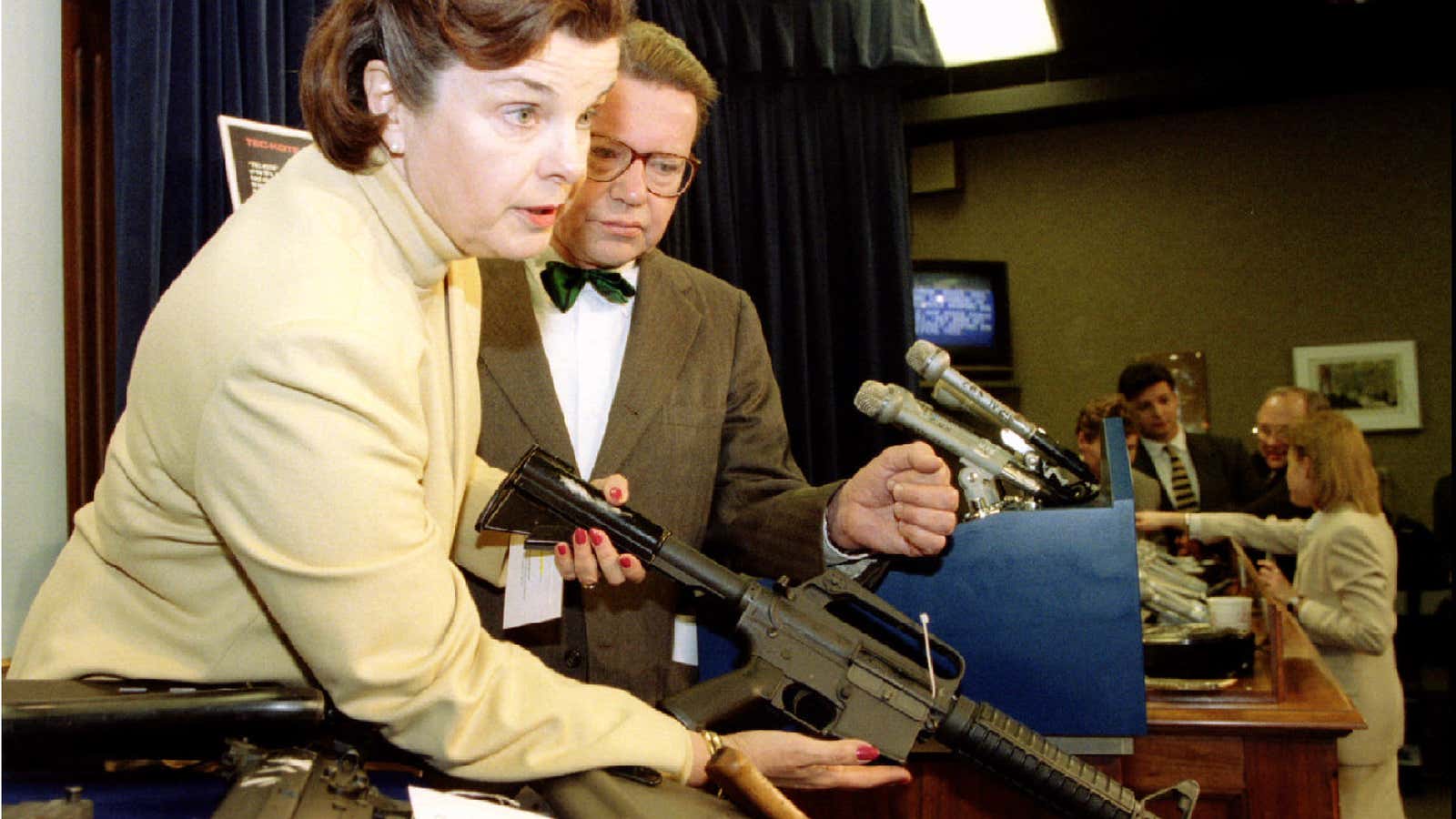 Senator Diane Feinstein displays an assault rifle at a press conference in 1994.