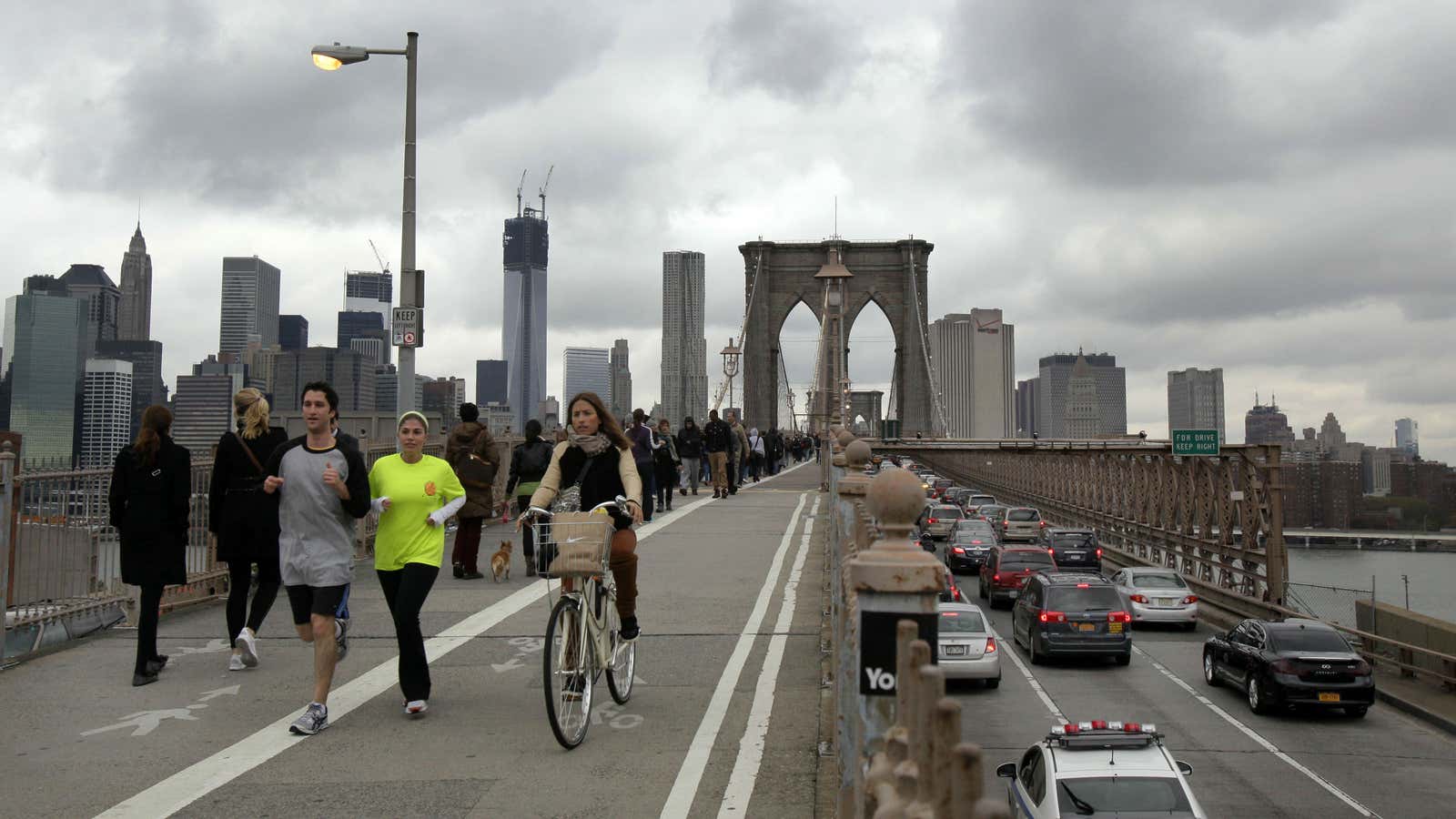 Commuters crossing Brooklyn Bridge today.