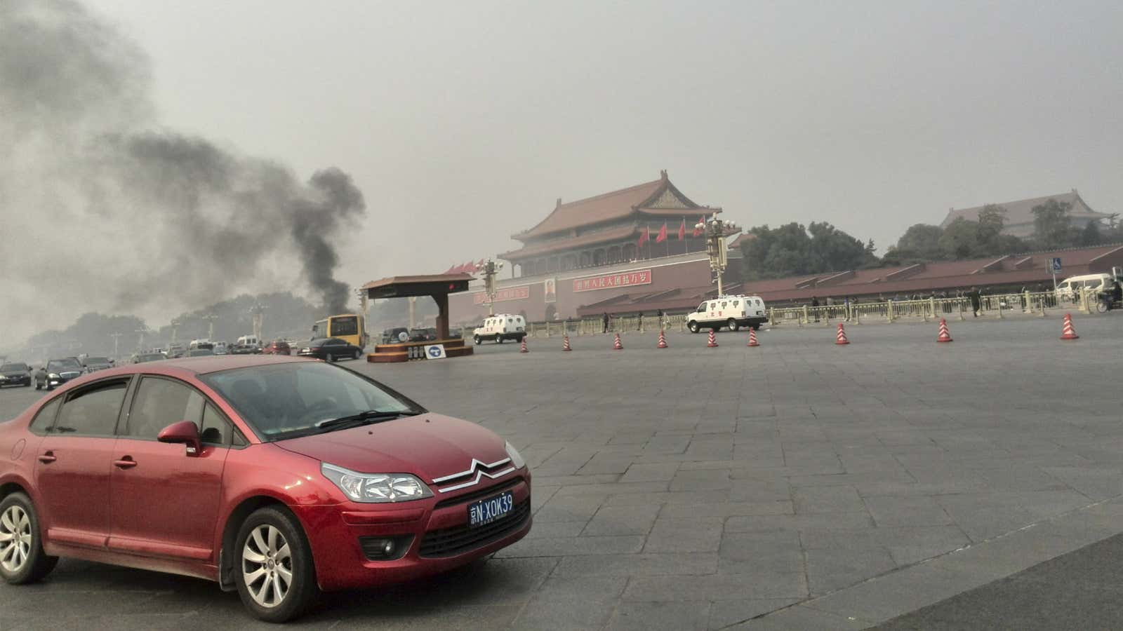Smoke rises in Tiananmen Square after a vehicle explosion that killed five.