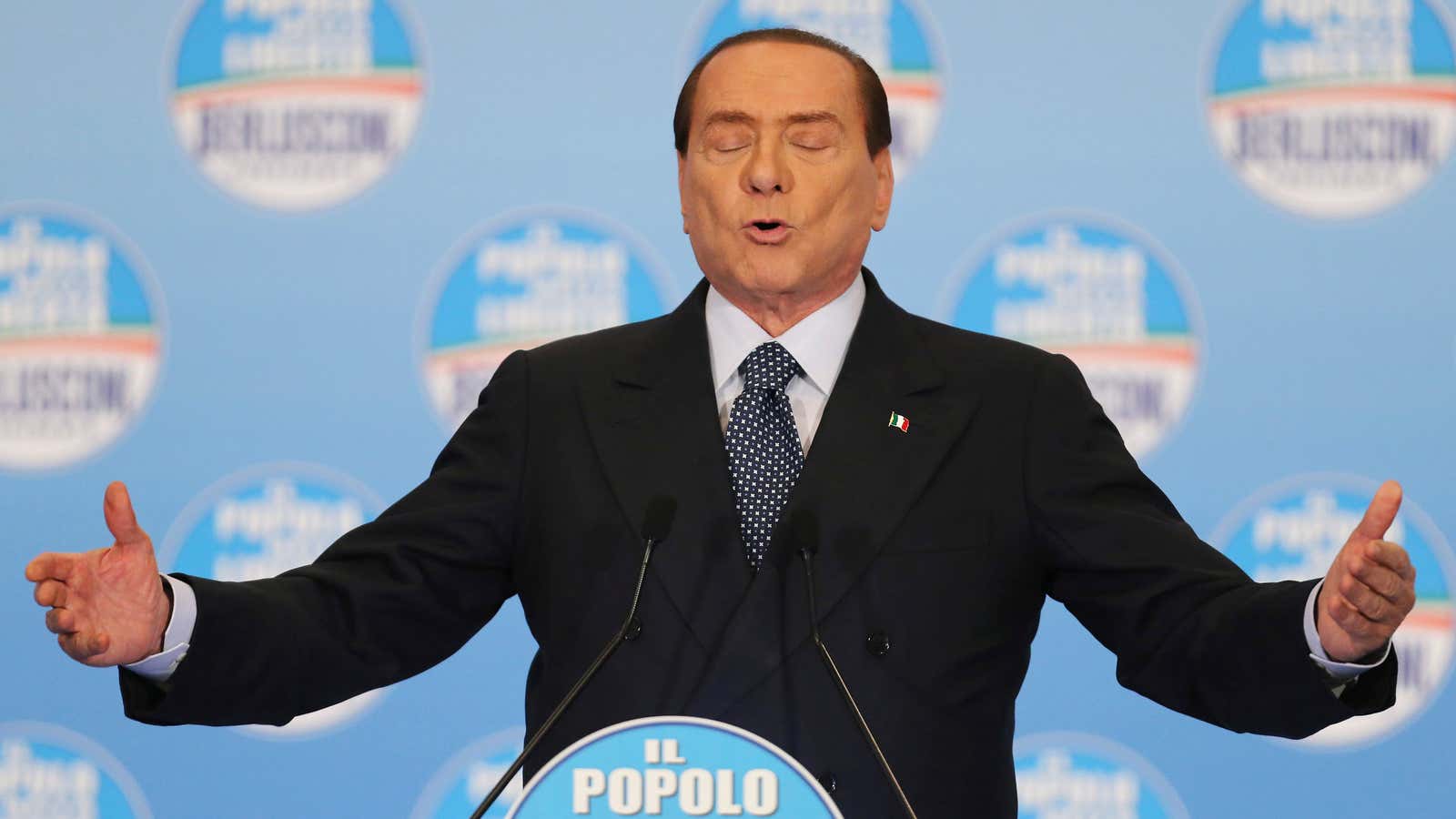 Pucker up! Berlusconi looks to plant a kiss on the Italian electorate.