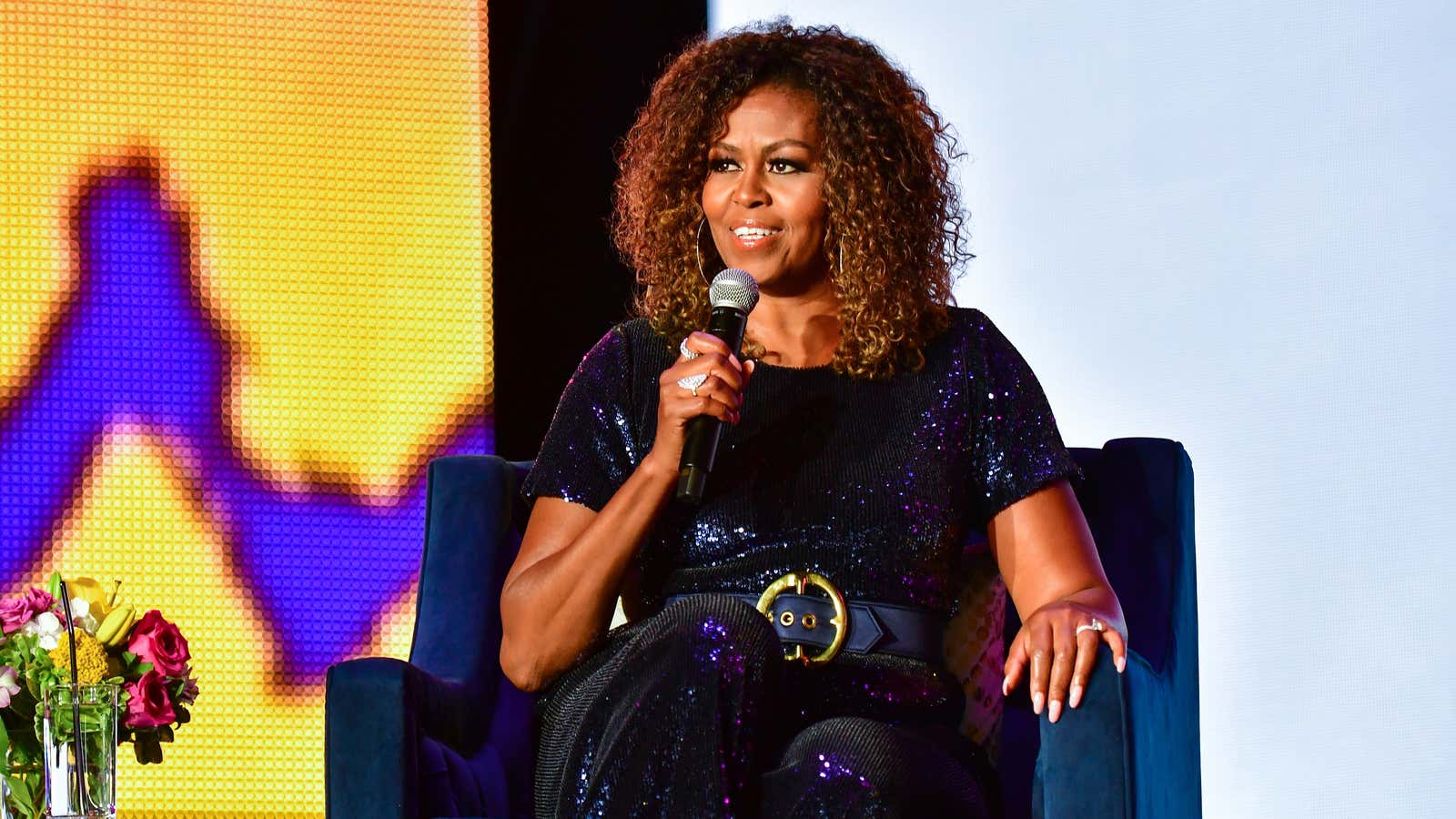 Michelle Obama welcomes a familiar guest at the launch of her new podcast