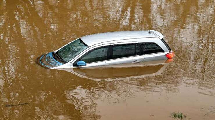 Image for Car Sinking Into Lake Has Hazard Lights On