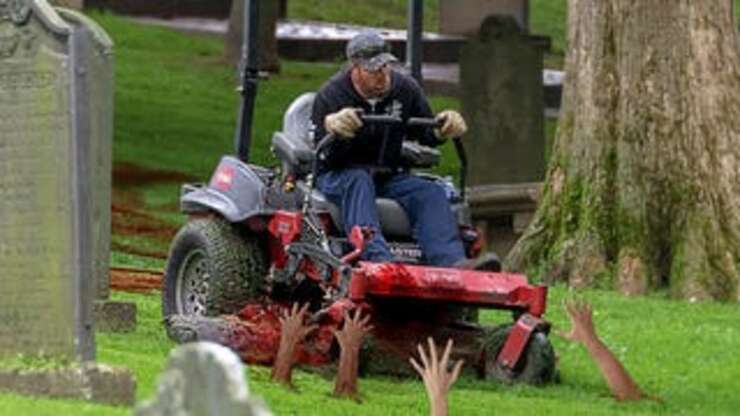 Image for Cemetery Groundskeeper Starts Each Day By Trimming Hands Poking Out Of Ground