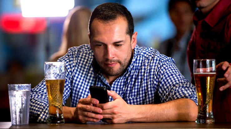 Image for Bar Breathes Collective Sigh Of Relief As Drunk Guy With Obnoxious Laugh Gets Really Invested In His Phone
