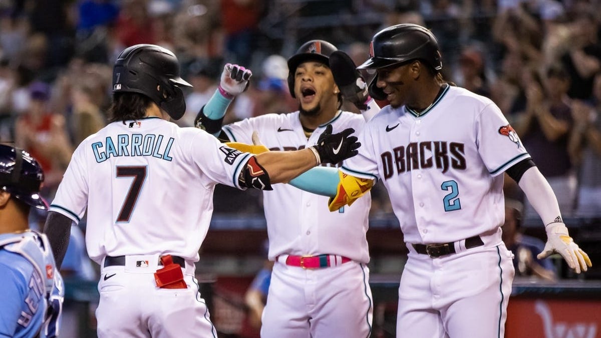 Tampa Bay Rays' Evan Longoria, left, celebrates with teammate