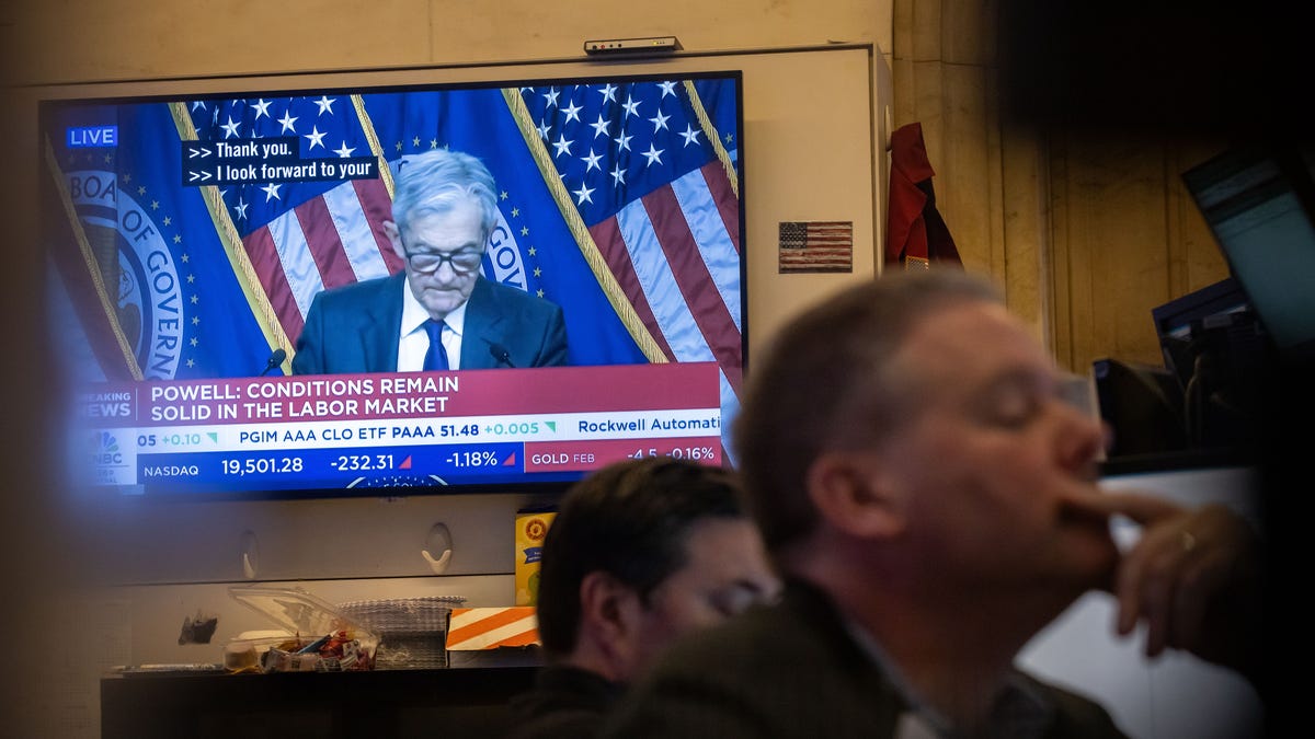 The Dow slips as Trump's trade war heats up and Jerome Powell takes the hot seat