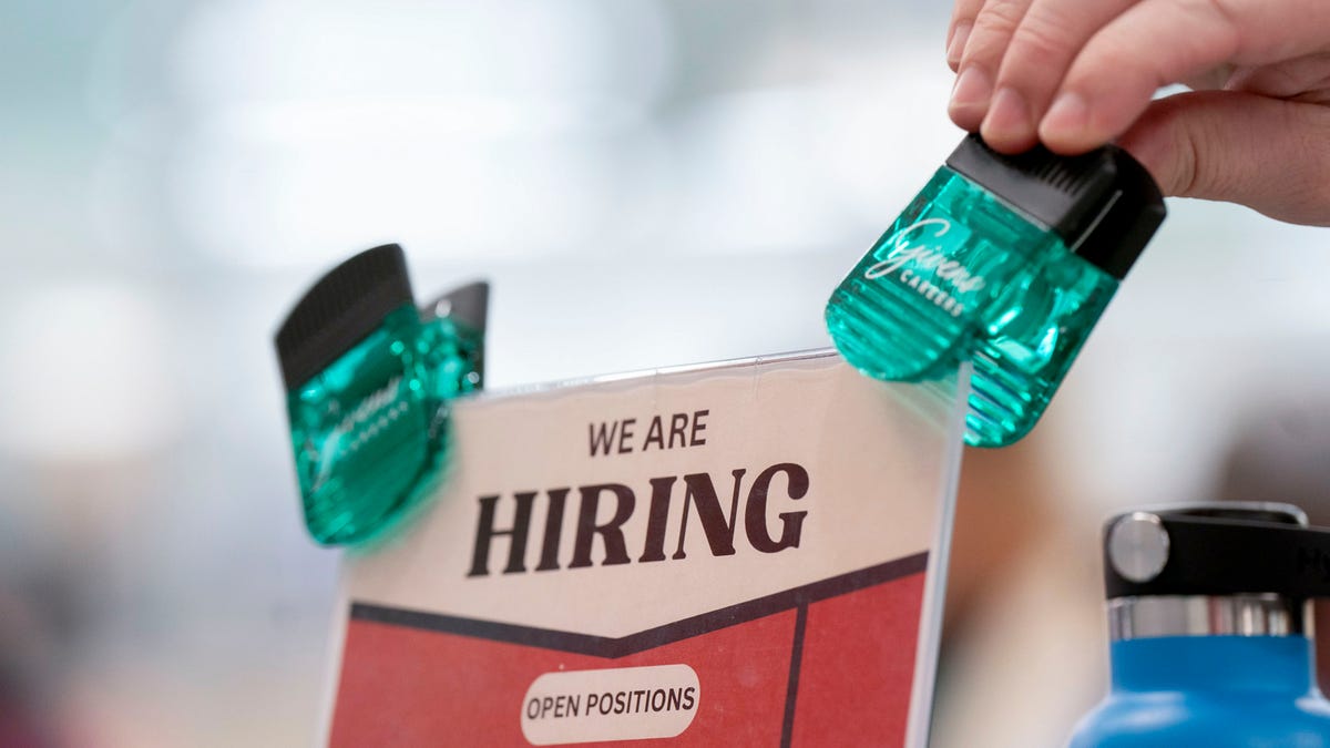Payrolls rose 256,000 and unemployment dropped slightly in December