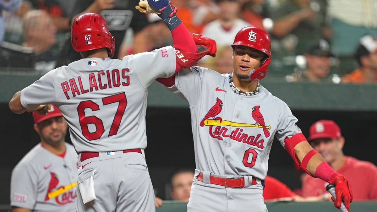 Adam Wainwright finally earns his 199th victory, and Cardinals top  AL-leading Orioles 5-2