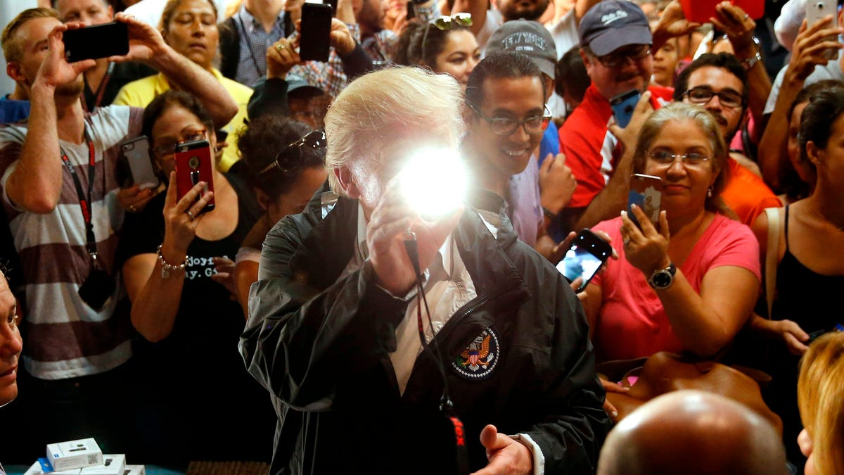 Trump in Puerto Rico: Pictures of Donald Trump throwing paper towel ...