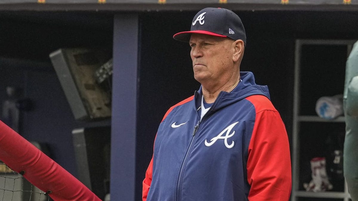 Atlanta Braves manager Brian Snitker watches from the dugout