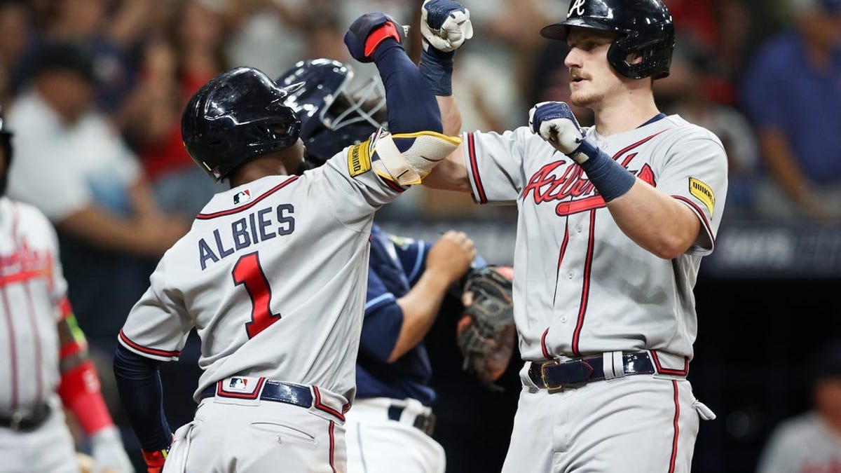 Sean Murphy of the Atlanta Braves celebrates with Matt Olson of