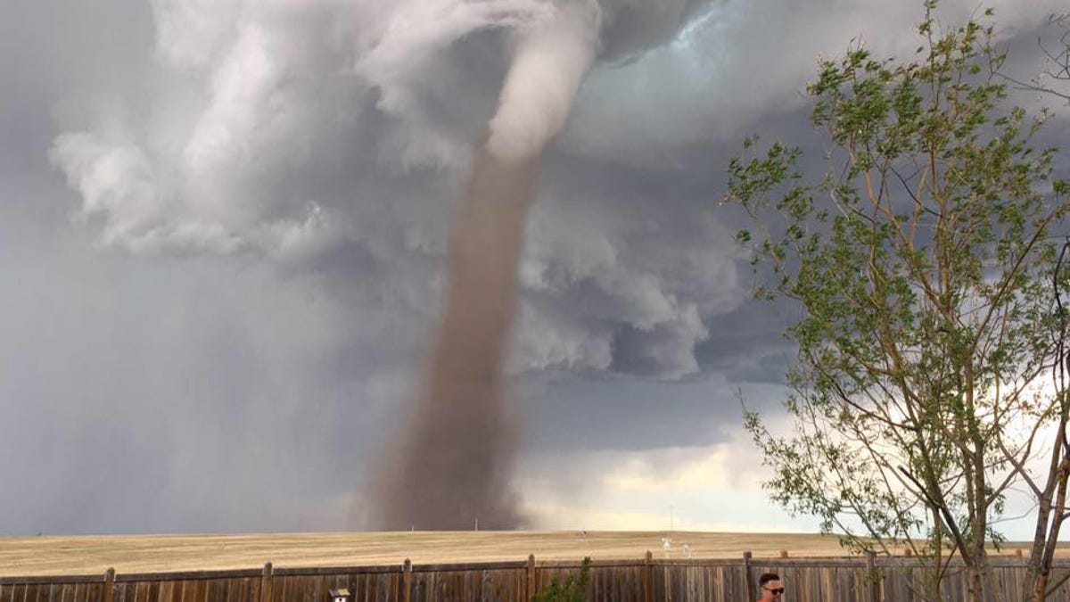 The Man Mowing His Lawn Under A Tornado In A Viral Photo Is A Master Of 