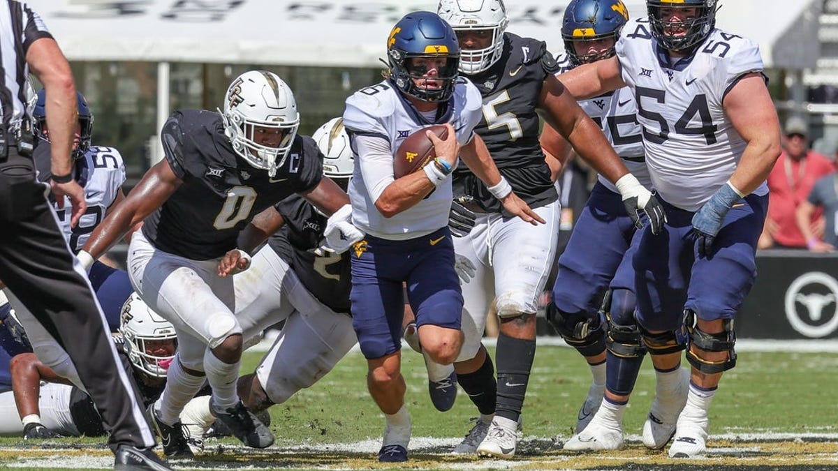 Garrett Greene runs, passes West Virginia past UCF