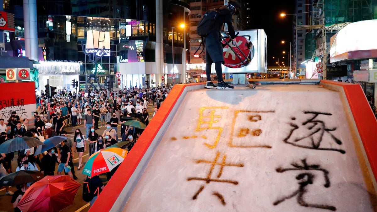Hong Kong is shutting down as a new anti-mask law deepens anger