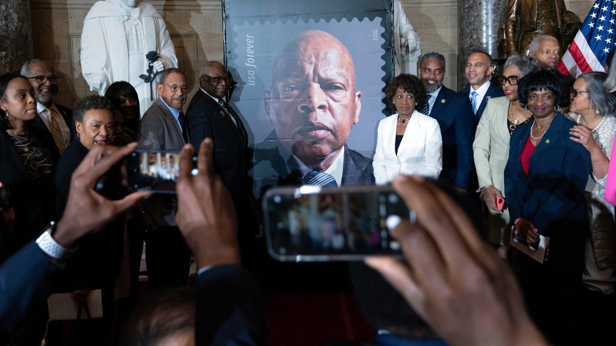 Who are other Georgians that John Lewis joins on U.S. stamps?
