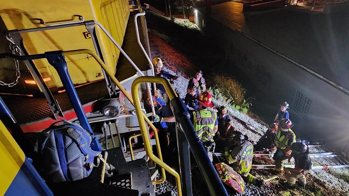 Man Survives Being Run Over By Freight Train And Tangled In Wheel Axle