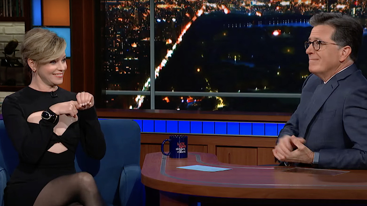 New sex ed podcaster Elizabeth Banks toasts the clitoris with Stephen  Colbert