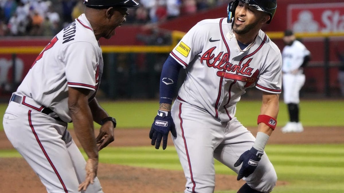 Atlanta Braves' Eddie Rosario, right, celebrates his home run against the  Arizona Diamondbacks with third base coach Ron Washington during the  seventh inning of a baseball game Friday, June 2, 2023, in