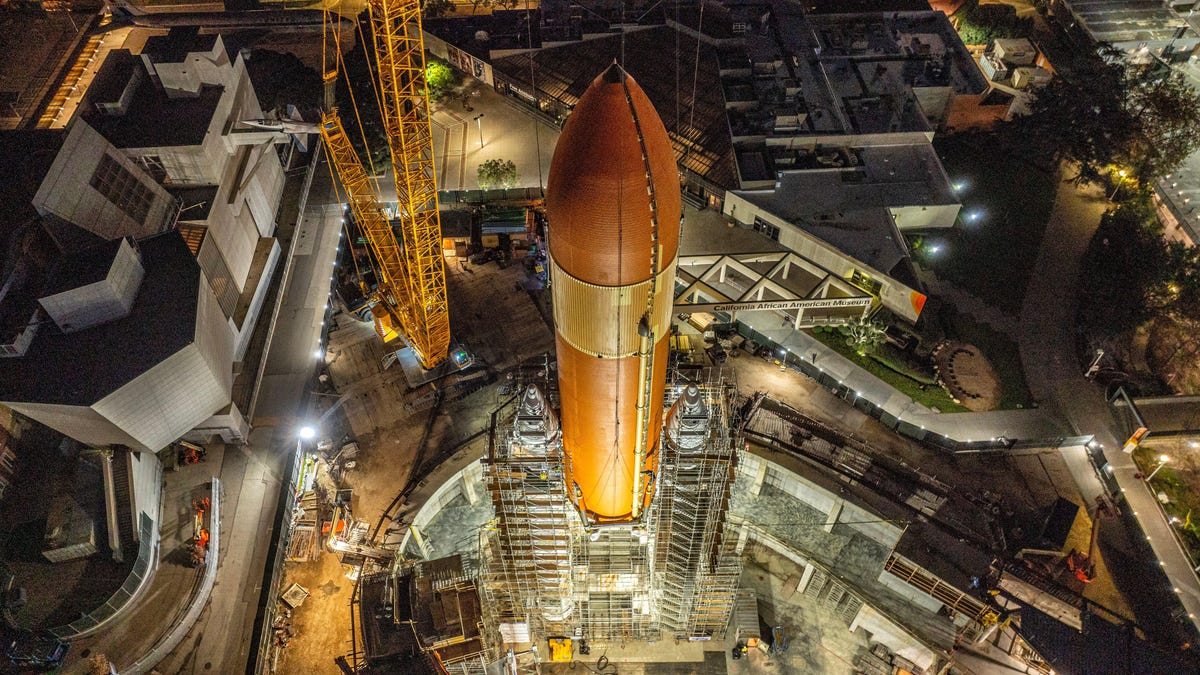 Space Shuttle's Massive Tank Hoisted Atop Rocket Boosters for Historic Display