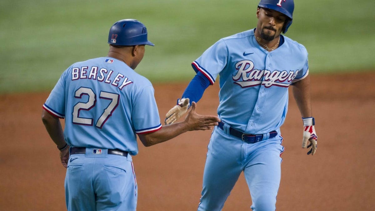 Seattle Mariners' Sam Haggerty rounds third base against against