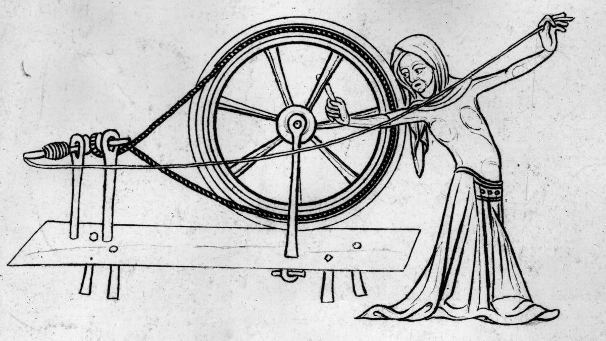 Woman At Spinning Wheel Making Yarn Stock Photo, Picture and