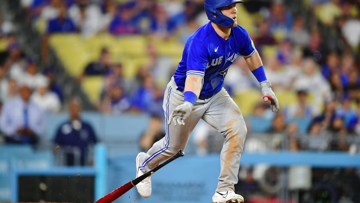 Toronto Blue Jays left fielder Daulton Varsho (25) swings at the