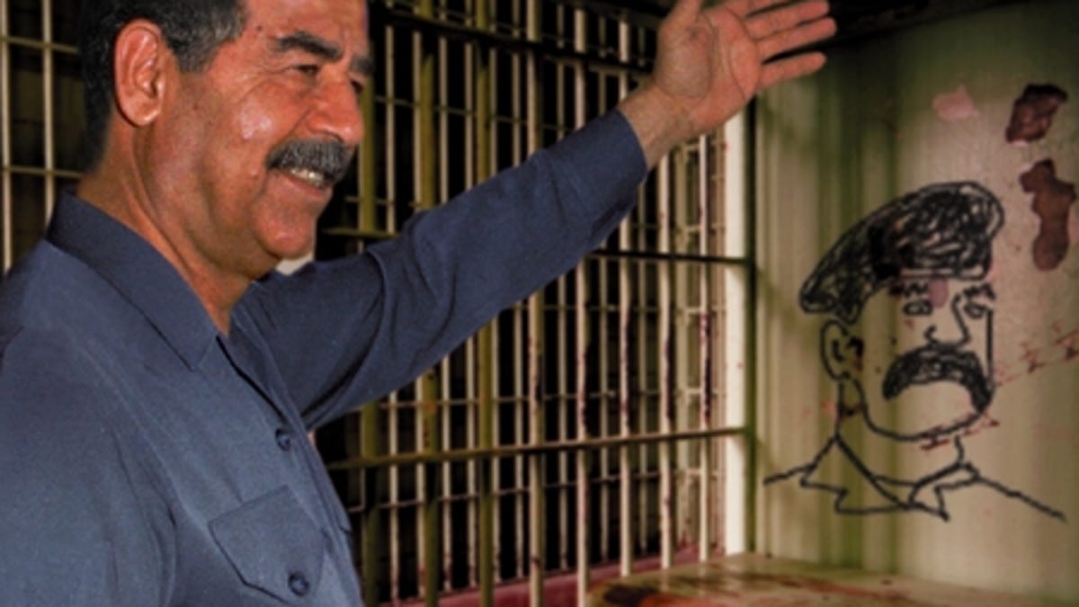 Saddam Hussein Rules Over Cell With Iron Fist