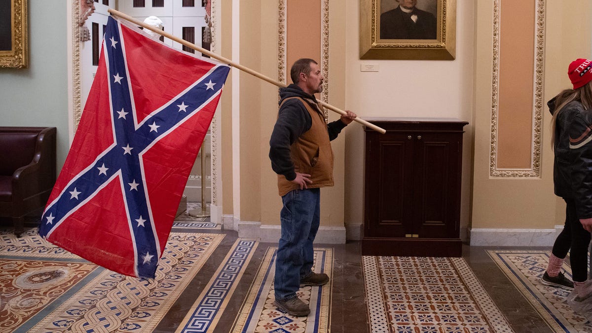 FBI Narrows Down Identity Of Red-Faced Man Carrying Confederate Flag ...