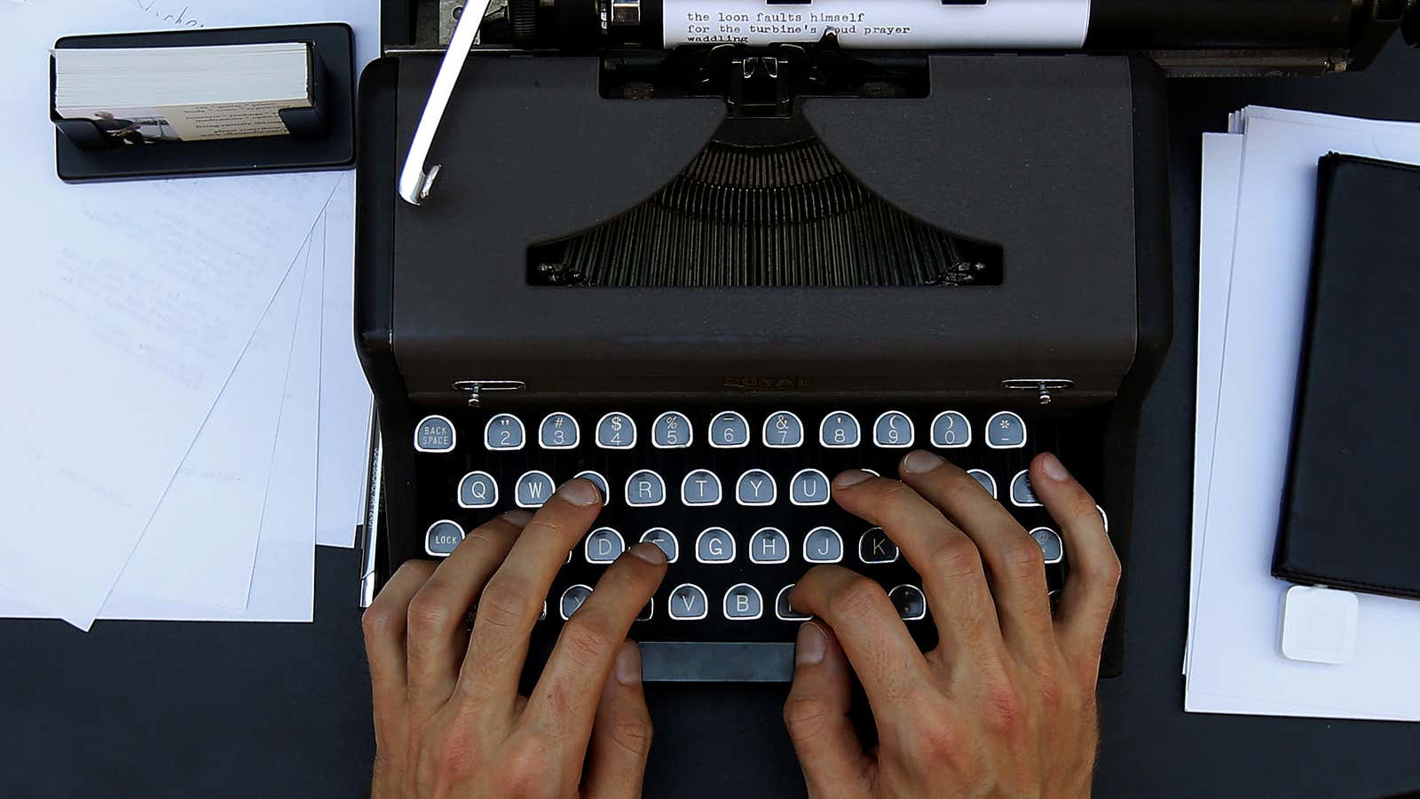 Street poet Allan Andre, who writes impromptu poems on an old typewriter, works on a composition on the sidewalk in New York City, New York,…