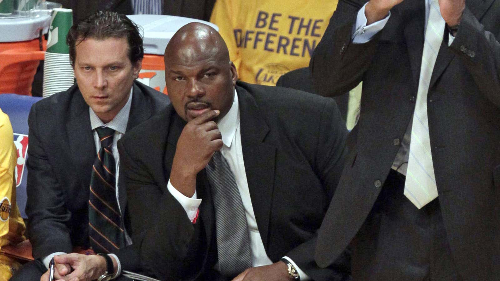 Former NBA star Chuck Person (center) is one of the assistant coaches named in the federal complaint.